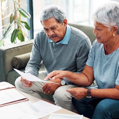 senior couple discussing finance documents